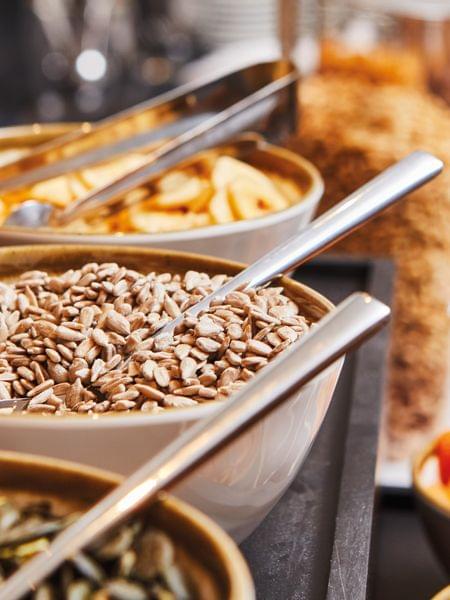 A perfect start to the skiing day. Healthy breakfast buffet with sunflower seeds, dried fruits and various cereals